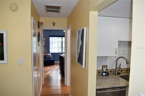 a room that has a toilet and a car parked in it