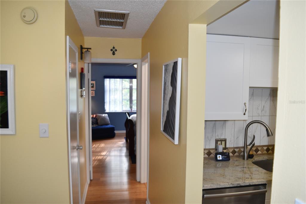 4746 Azalea Drive, Unit 208C New Port Richey, FL 34652 - Photo 12 of 56 a kitchen with a refrigerator and a sink