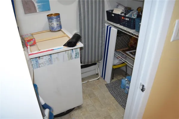 a kitchen with a refrigerator and a sink