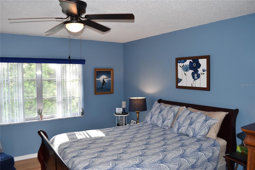 4746 Azalea Drive, Unit 208C New Port Richey, FL 34652 - Photo 25 of 56 a bedroom with a bed and a window