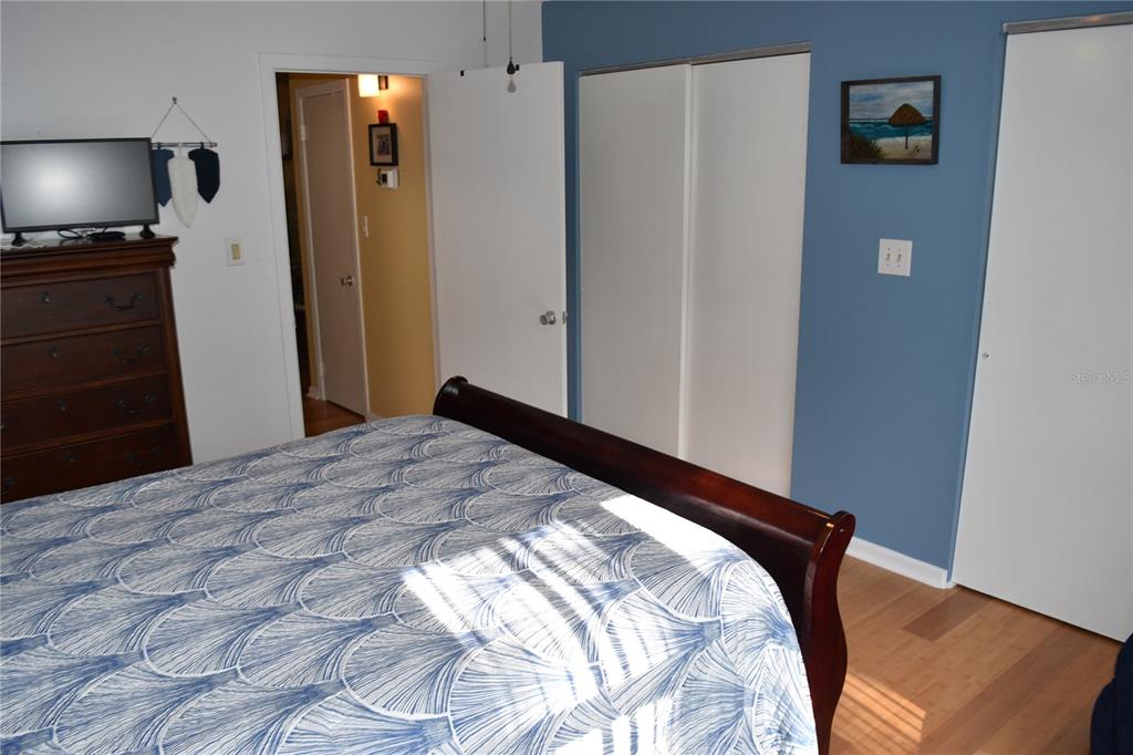 4746 Azalea Drive, Unit 208C New Port Richey, FL 34652 - Photo 29 of 56 a bedroom with a bed and a flat screen tv