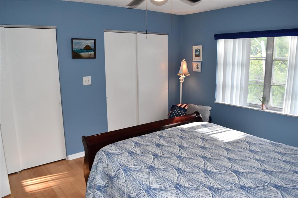 4746 Azalea Drive, Unit 208C New Port Richey, FL 34652 - Photo 34 of 56 a bedroom with a bed and a window