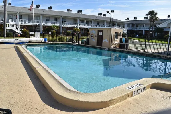 a view of a swimming pool with a patio