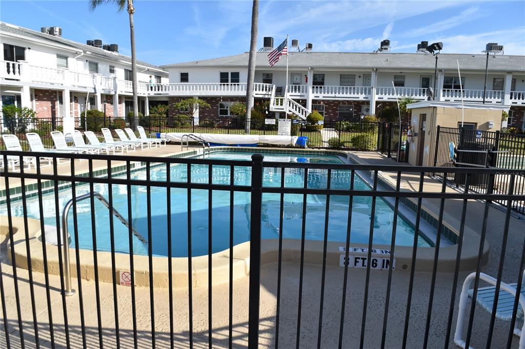 4746 Azalea Drive, Unit 208C New Port Richey, FL 34652 - Photo 36 of 56 a view of a chairs and a table in the balcony