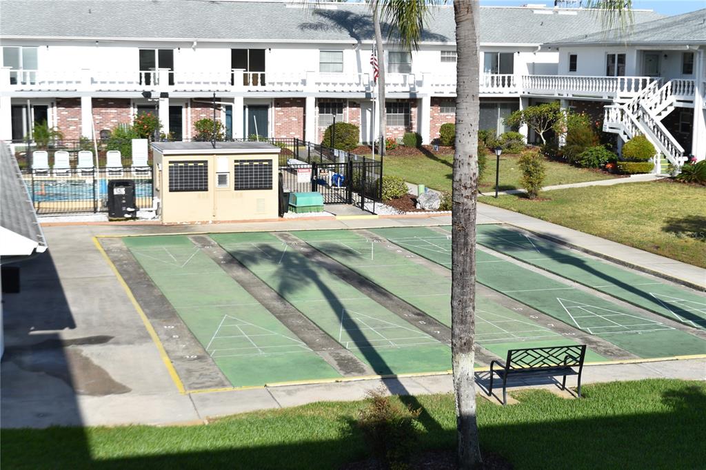 4746 Azalea Drive, Unit 208C New Port Richey, FL 34652 - Photo 38 of 56 a view of a building with a yard