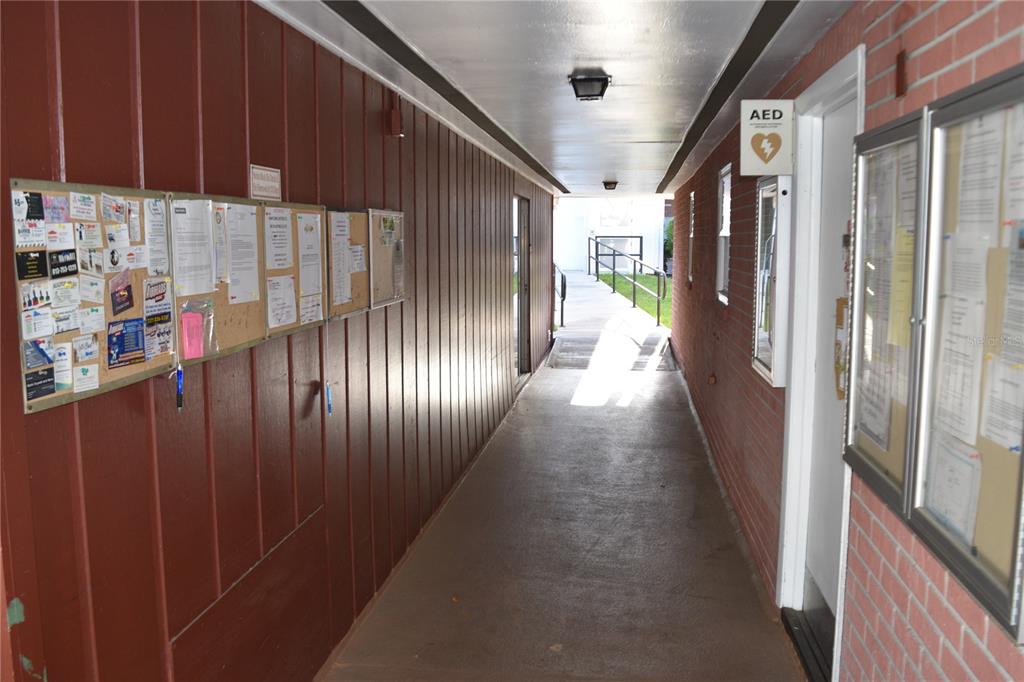 4746 Azalea Drive, Unit 208C New Port Richey, FL 34652 - Photo 47 of 56 a view of hallway with stairs