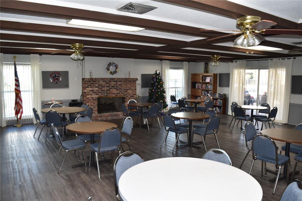 4746 Azalea Drive, Unit 208C New Port Richey, FL 34652 - Photo 53 of 56 a view of a dining room with furniture window and wooden floor