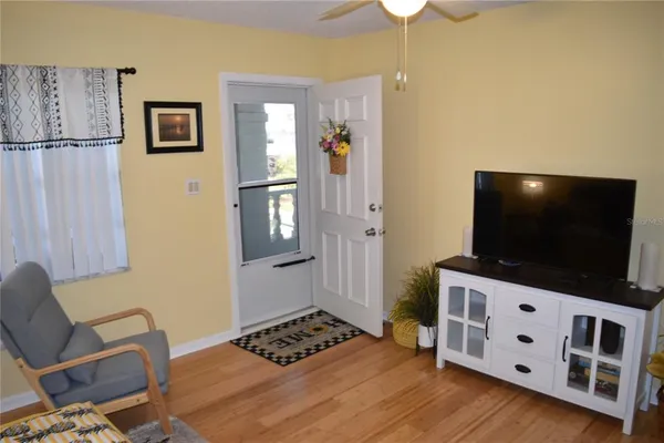 a room with furniture and a flat screen tv