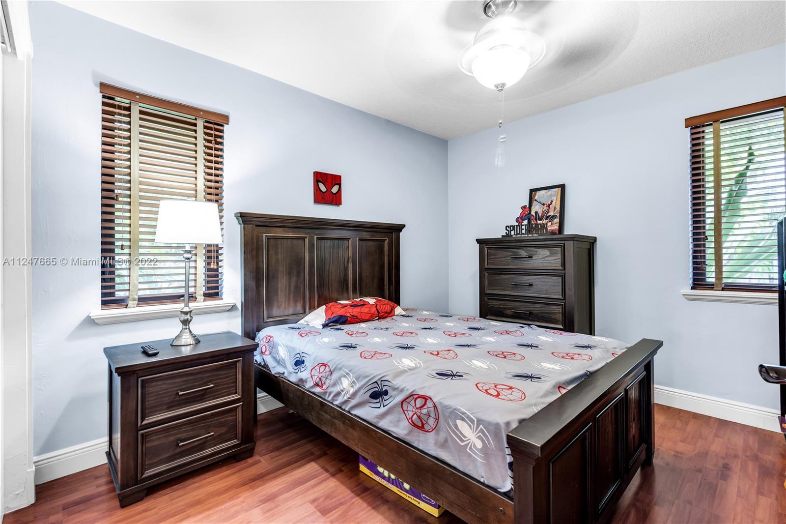 11809 Southwest 95th Street Miami, FL 33186 - Photo 18 of 25 a bed room with a bed and a window