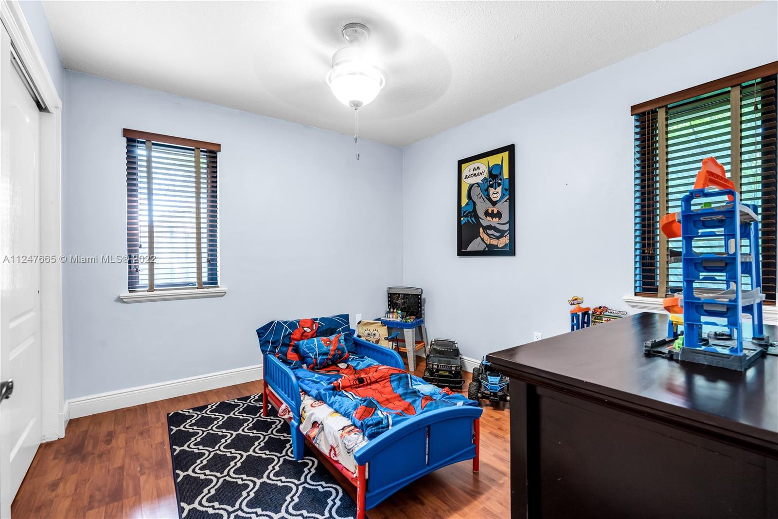 11809 Southwest 95th Street Miami, FL 33186 - Photo 19 of 25 a living room with furniture and a window