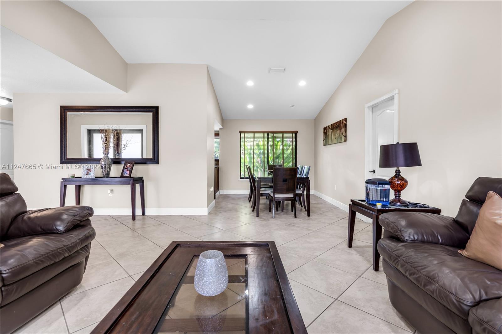 11809 Southwest 95th Street Miami, FL 33186 - Photo 8 of 25 a living room with furniture and wooden floor