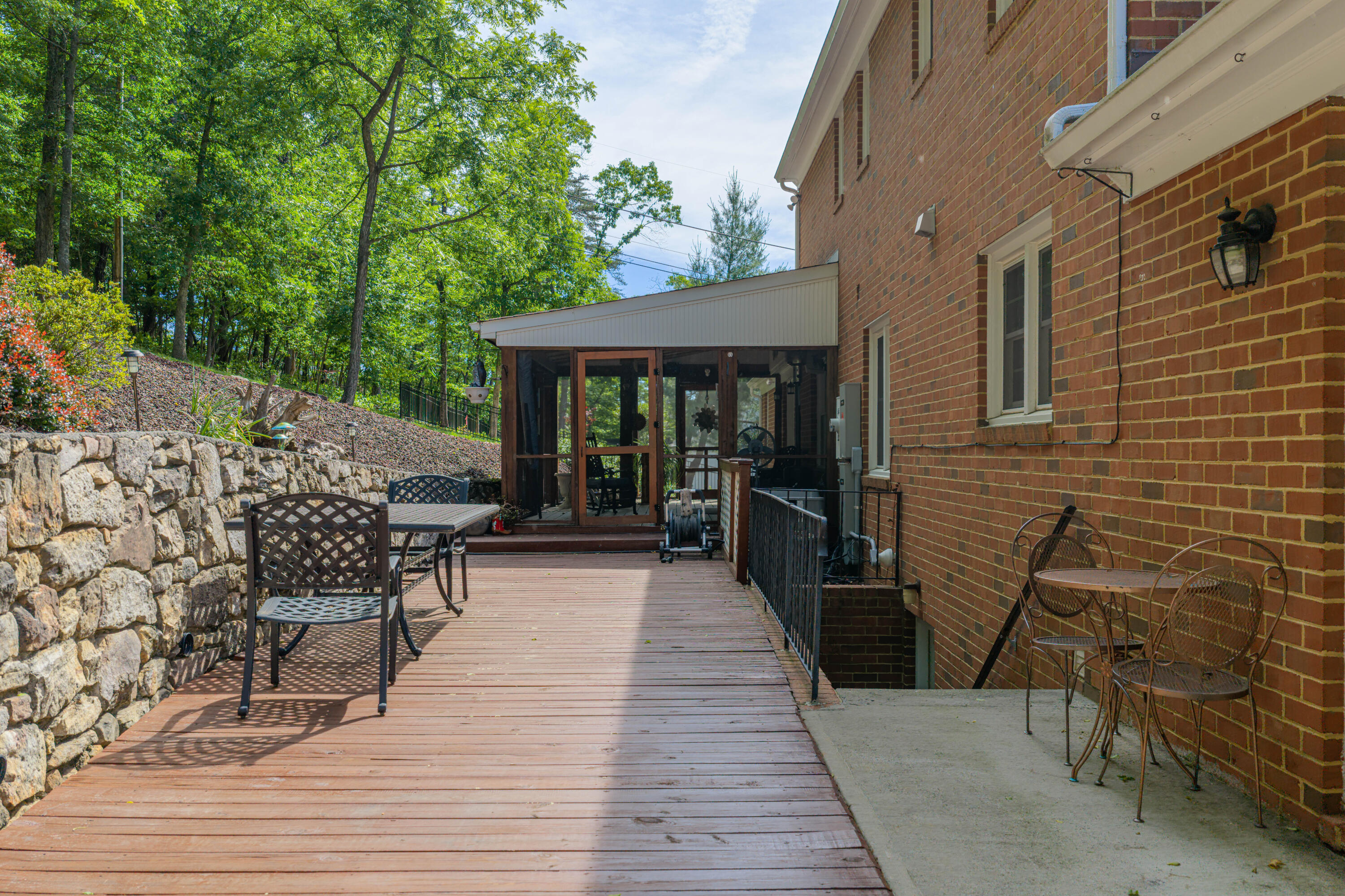 3341 Hidden Oak Road Southwest Roanoke, VA 24018 - Photo 4 of 26 a view of a patio with table and chairs with wooden floor and fence