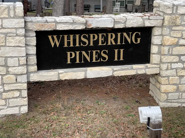 a street sign on a brick wall