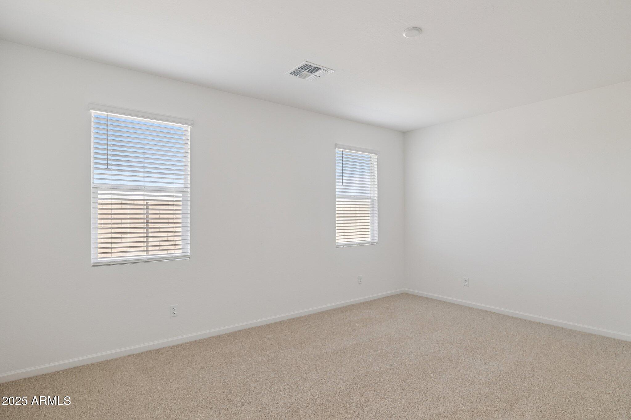 25453 West Fraktur Road Buckeye, AZ 85326 - Photo 6 of 18 a view of an empty room with a window
