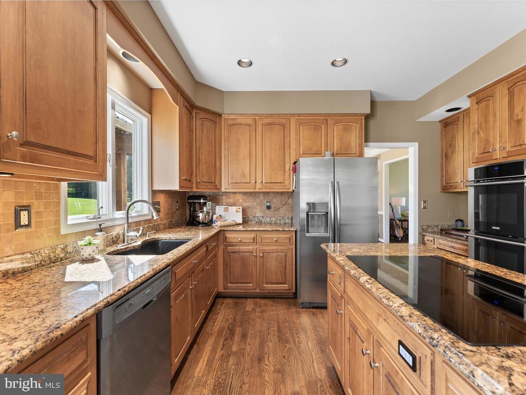 5915 Cabbage Spring Road Mount Airy, MD 21771 - Photo 14 of 68 Kitchen with Granite counters and Tile back splash