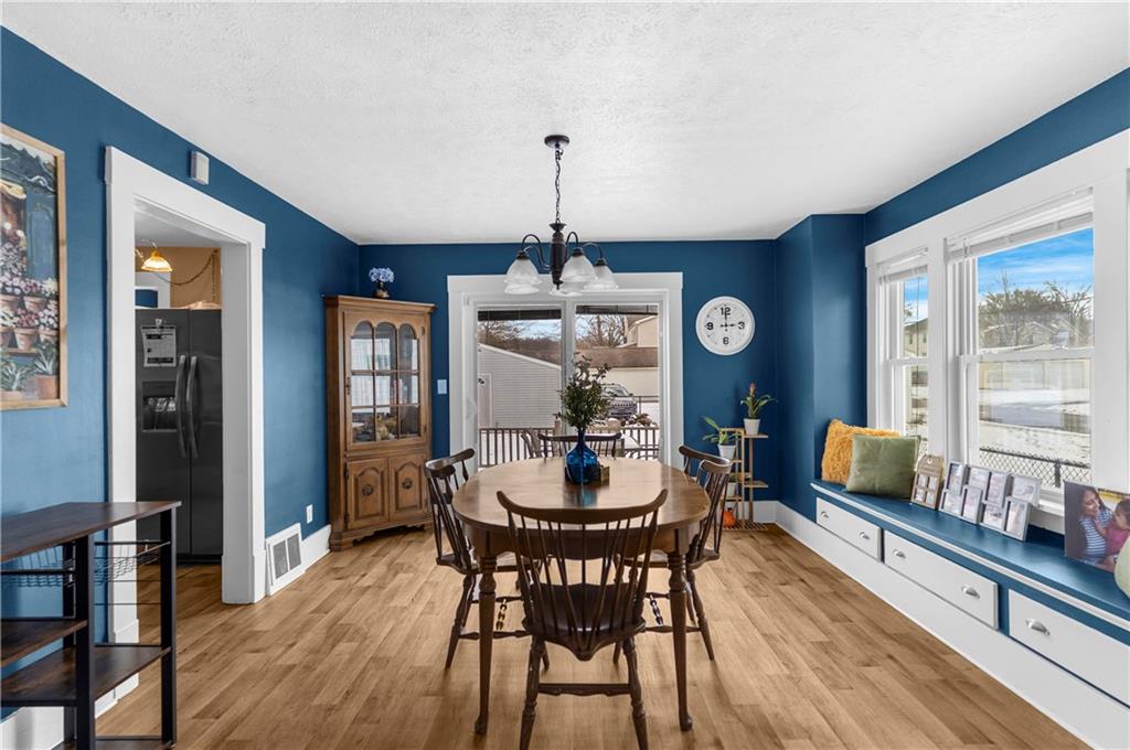1571 West Ridge Avenue Sharpsville, PA 16150 - Photo 16 of 30 a dining room with furniture a chandelier and wooden floor