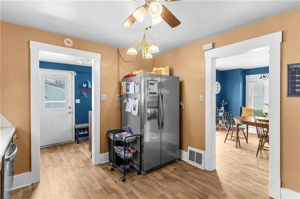 a kitchen with stainless steel appliances a sink stove and refrigerator