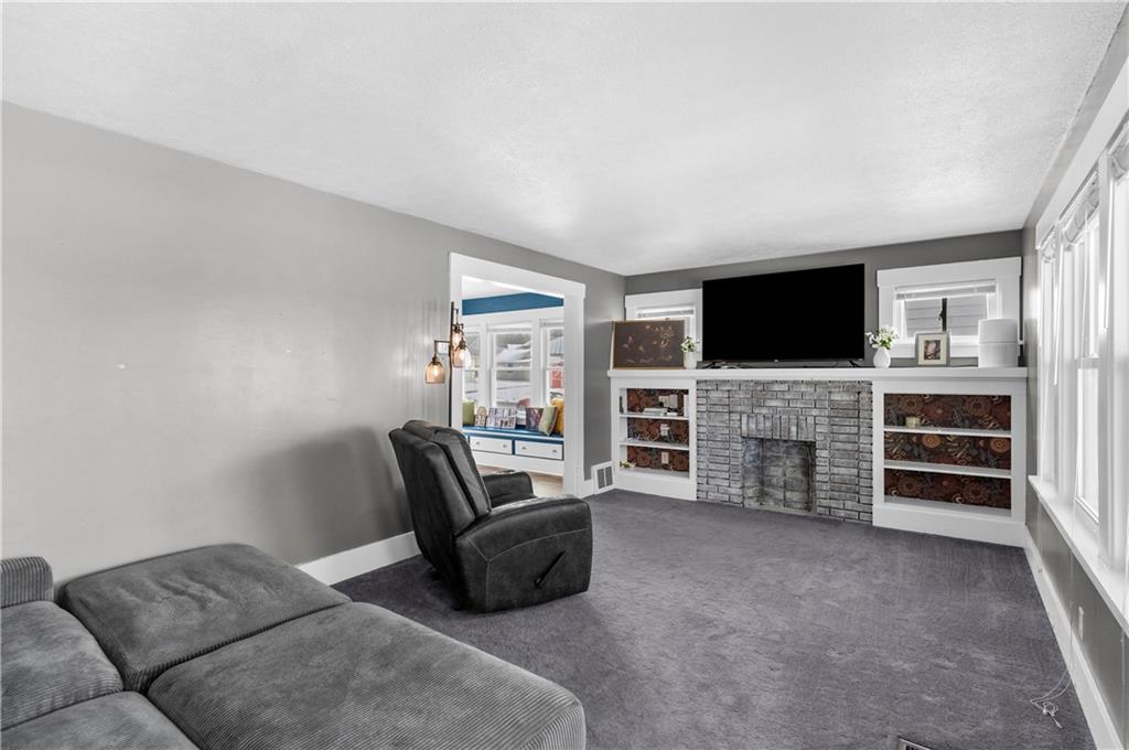 1571 West Ridge Avenue Sharpsville, PA 16150 - Photo 23 of 30 a living room with furniture and a flat screen tv