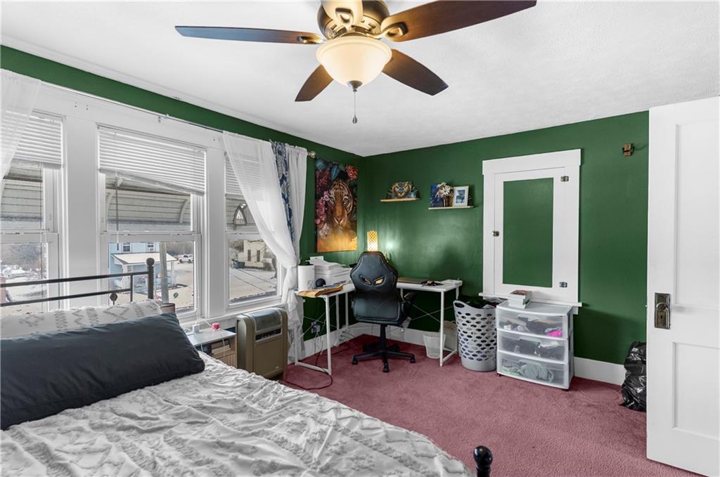 1571 West Ridge Avenue Sharpsville, PA 16150 - Photo 29 of 30 a bedroom with a bed a desk and chair