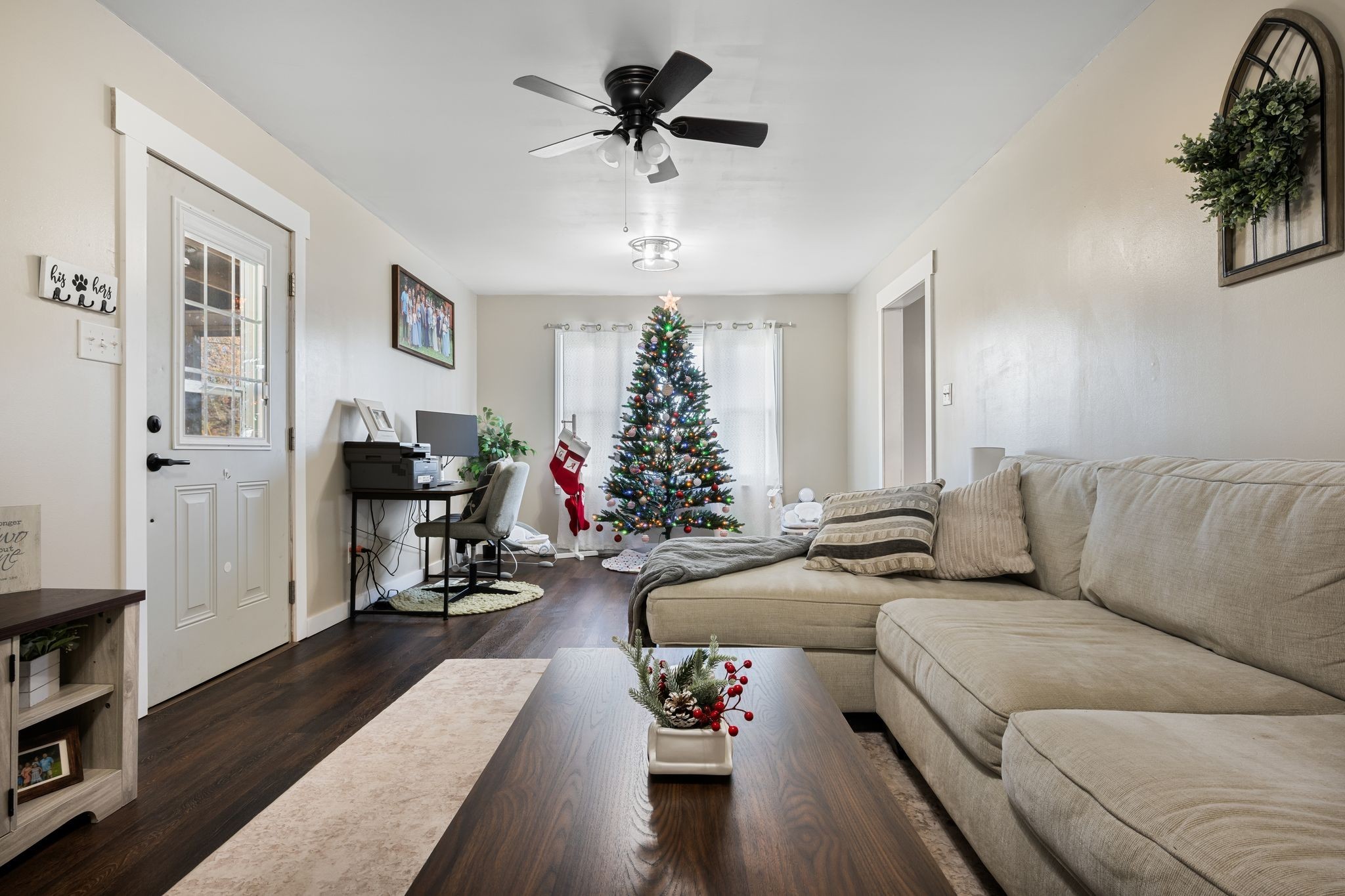 3205 Sylvia Road Dickson, TN 37055 - Photo 11 of 26 a living room with furniture flowers and a chandelier