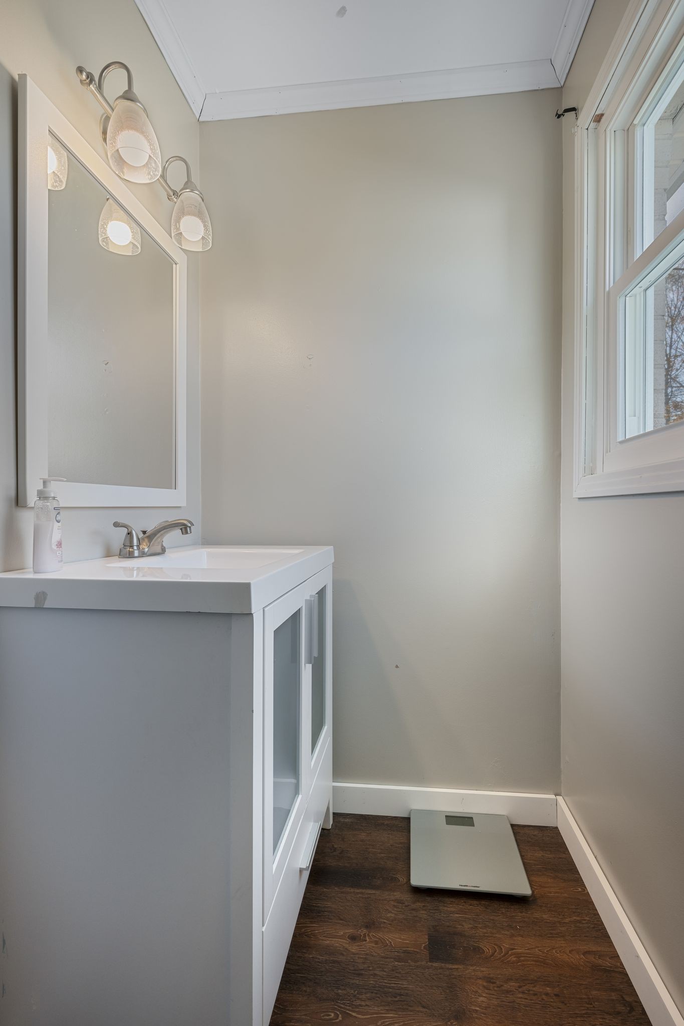 3205 Sylvia Road Dickson, TN 37055 - Photo 13 of 26 a bathroom with a sink and a mirror