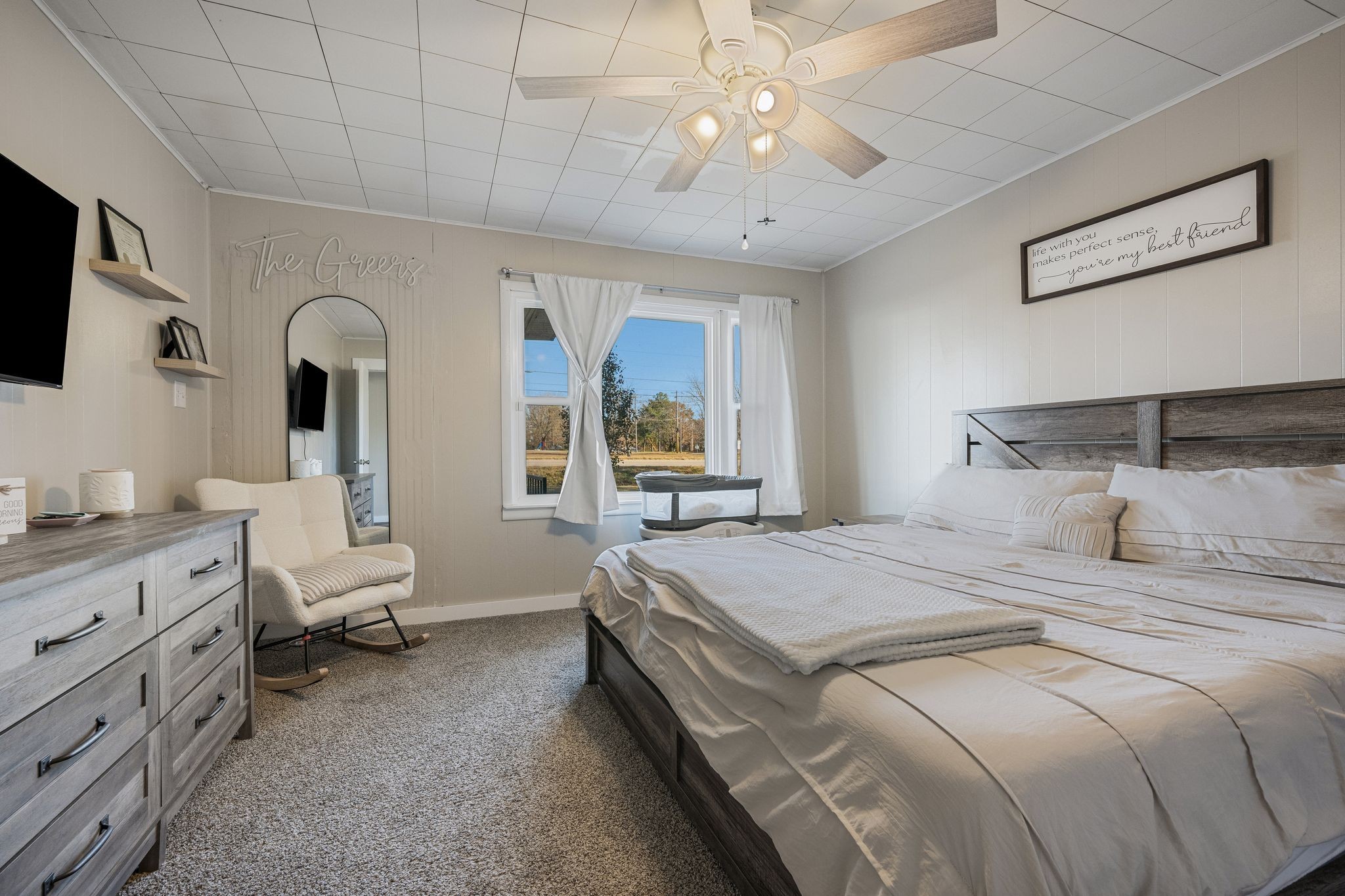 3205 Sylvia Road Dickson, TN 37055 - Photo 14 of 26 a bedroom with a large bed and a chandelier