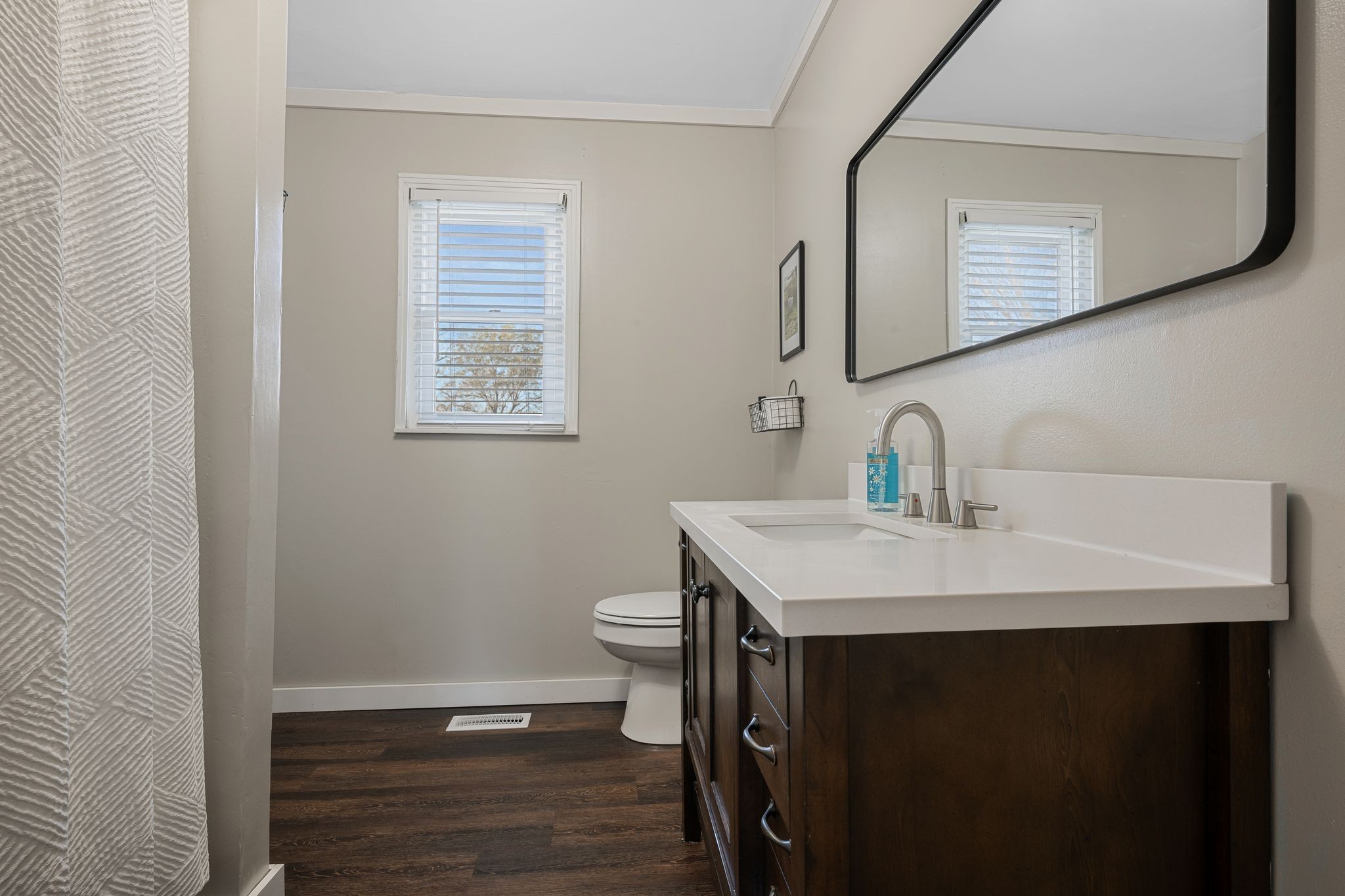3205 Sylvia Road Dickson, TN 37055 - Photo 19 of 26 a bathroom with a sink a toilet and mirror