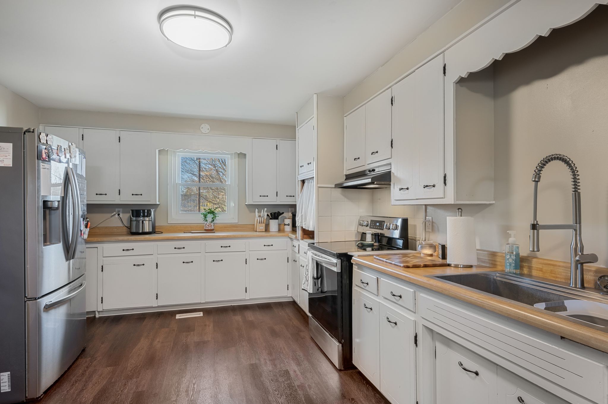 3205 Sylvia Road Dickson, TN 37055 - Photo 7 of 26 a kitchen with cabinets oven and a sink