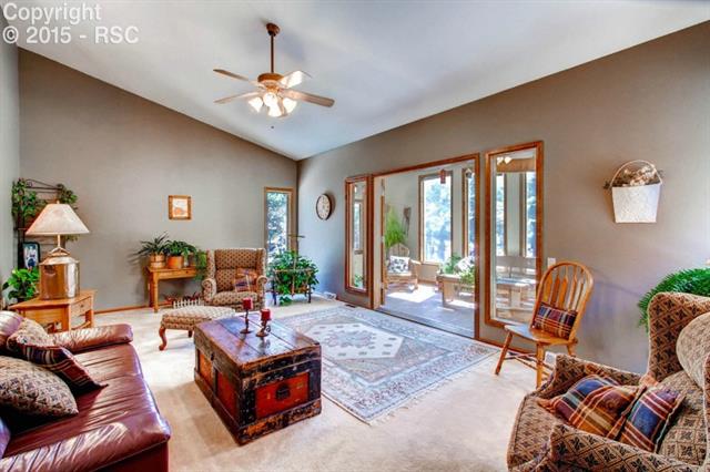 3210 Arena Road Colorado Springs, CO 80921 - Photo 6 of 19 Formal living room with sunroom adjoining.