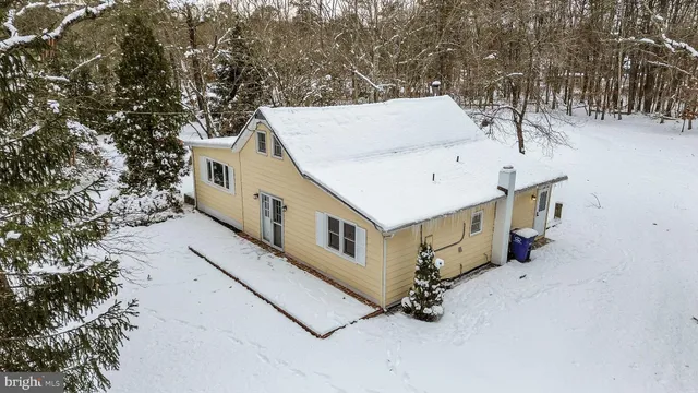 a view of house with a trees
