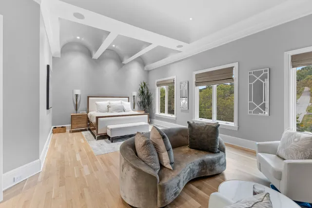 a bedroom with a bed and a couch