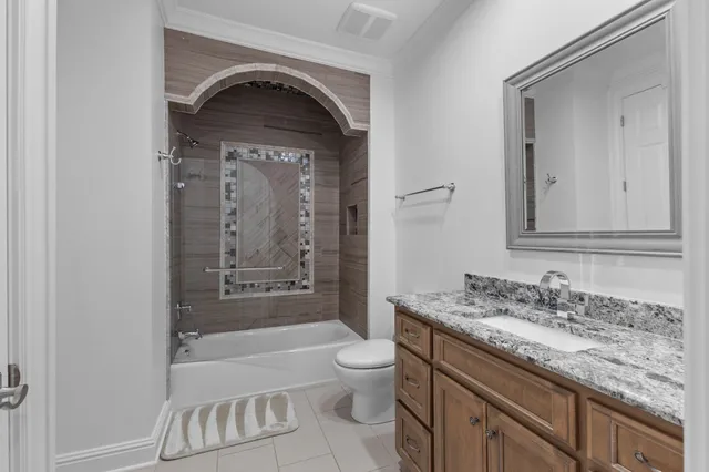 a view of a chair and fire pit in the backyard of a house