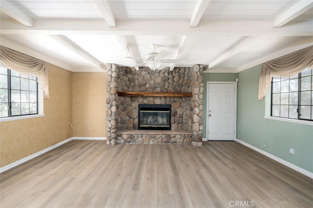 34150 Stowe Road Winchester, CA 92545 - Photo 14 of 80 an empty room with windows and fireplace