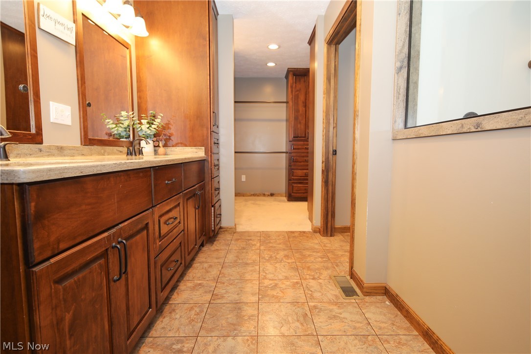 38610 Spiedel Town Road Bethesda, OH 43719 - Photo 23 of 33 Bathroom featuring tile patterned floors and vanity