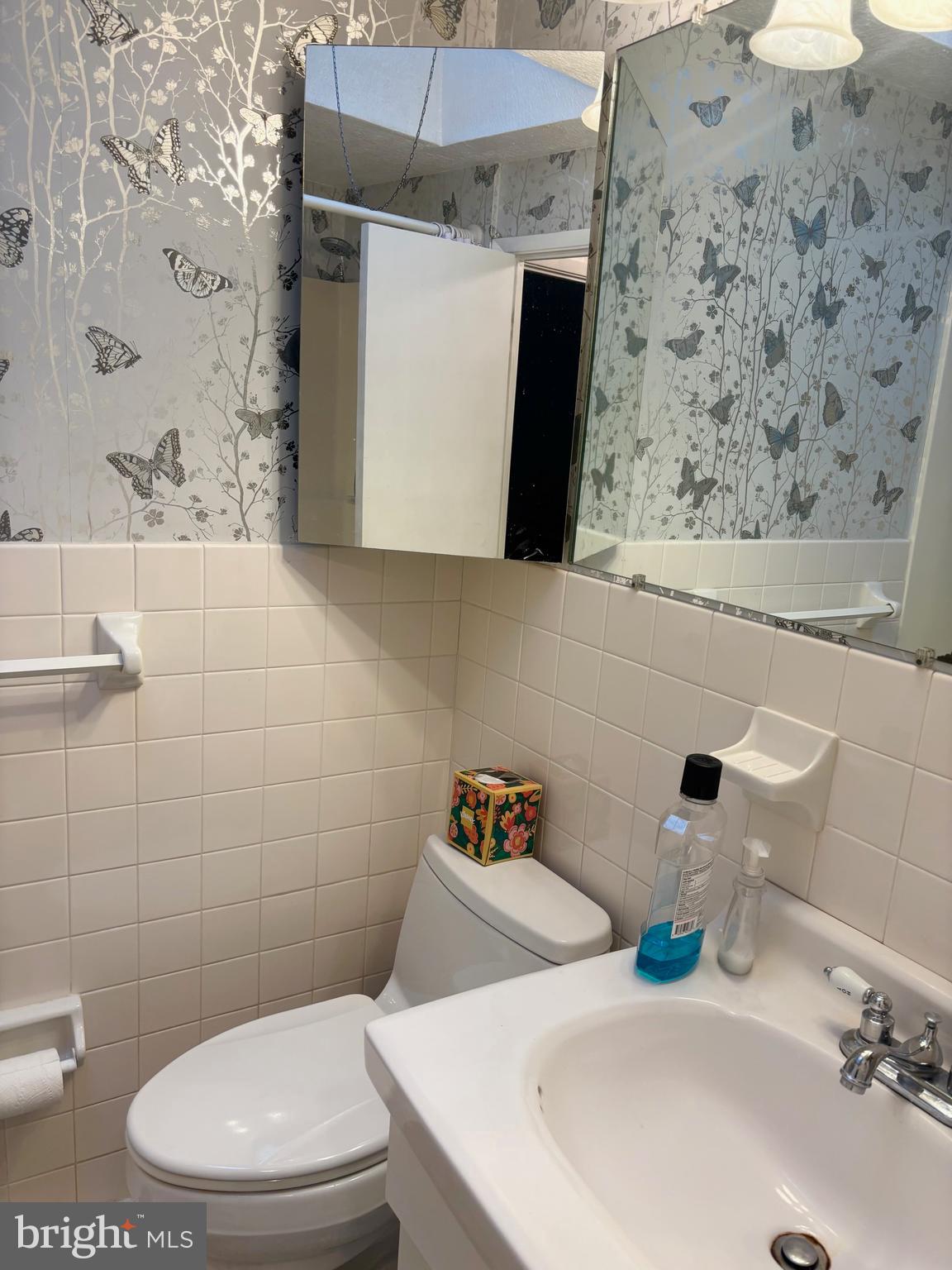 12517 Ramer Road Philadelphia, PA 19154 - Photo 16 of 24 a bathroom with a toilet sink and mirror