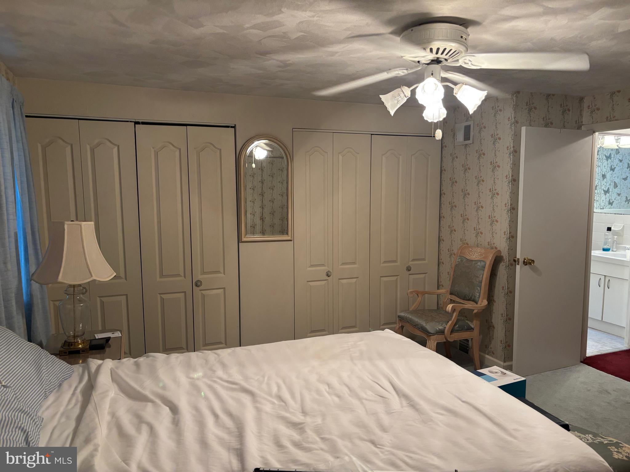 12517 Ramer Road Philadelphia, PA 19154 - Photo 10 of 24 a bedroom with a bed and a chandelier