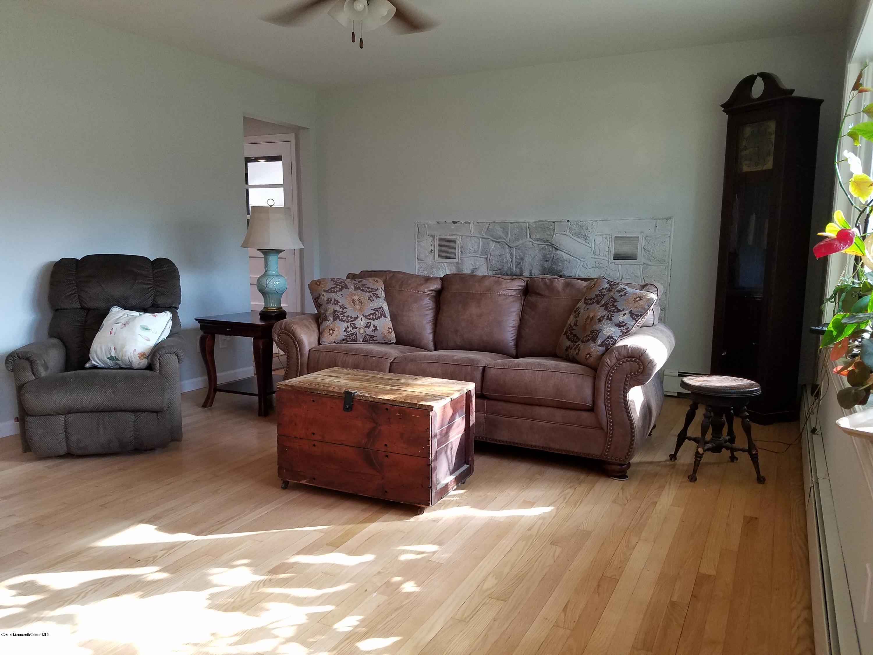 117 Maxim Road Howell, NJ 07731 - Photo 11 of 28 a living room with furniture and a couch