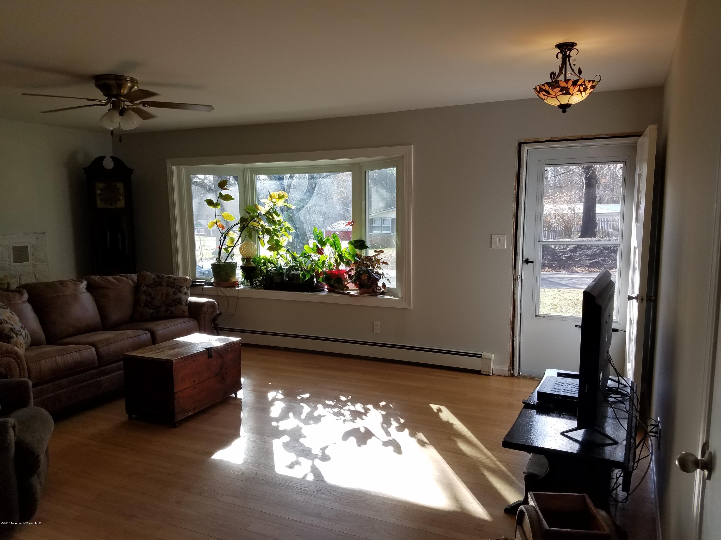 117 Maxim Road Howell, NJ 07731 - Photo 13 of 28 a living room with furniture and a large window