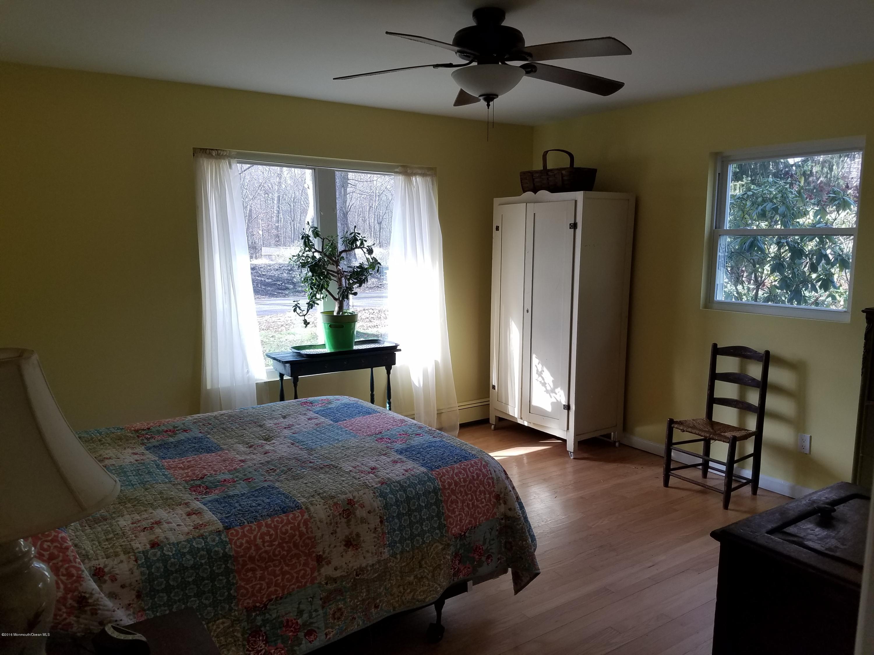 117 Maxim Road Howell, NJ 07731 - Photo 15 of 28 a bedroom with a bed dresser and a window