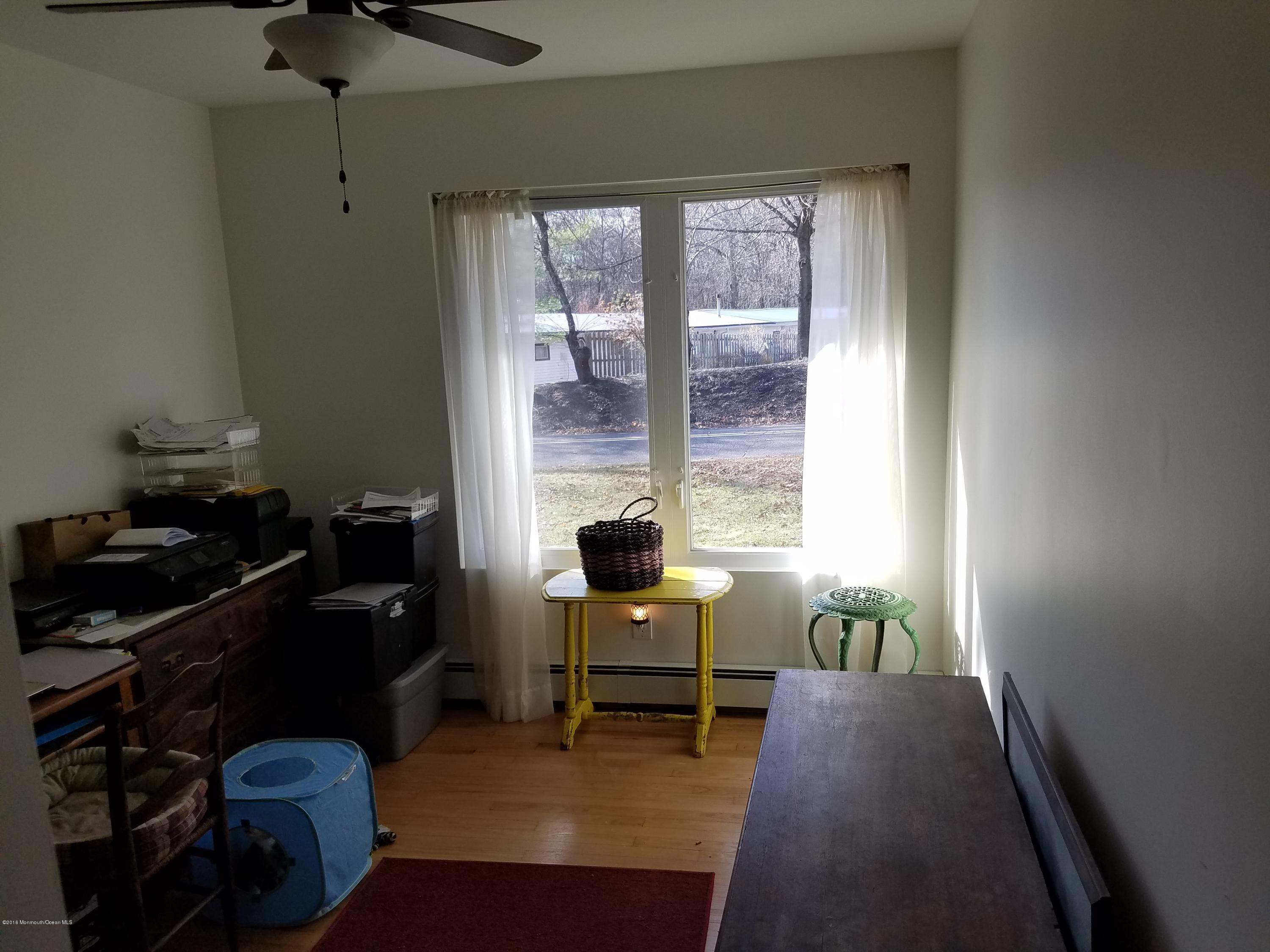 117 Maxim Road Howell, NJ 07731 - Photo 17 of 28 a bedroom with a bed and a window