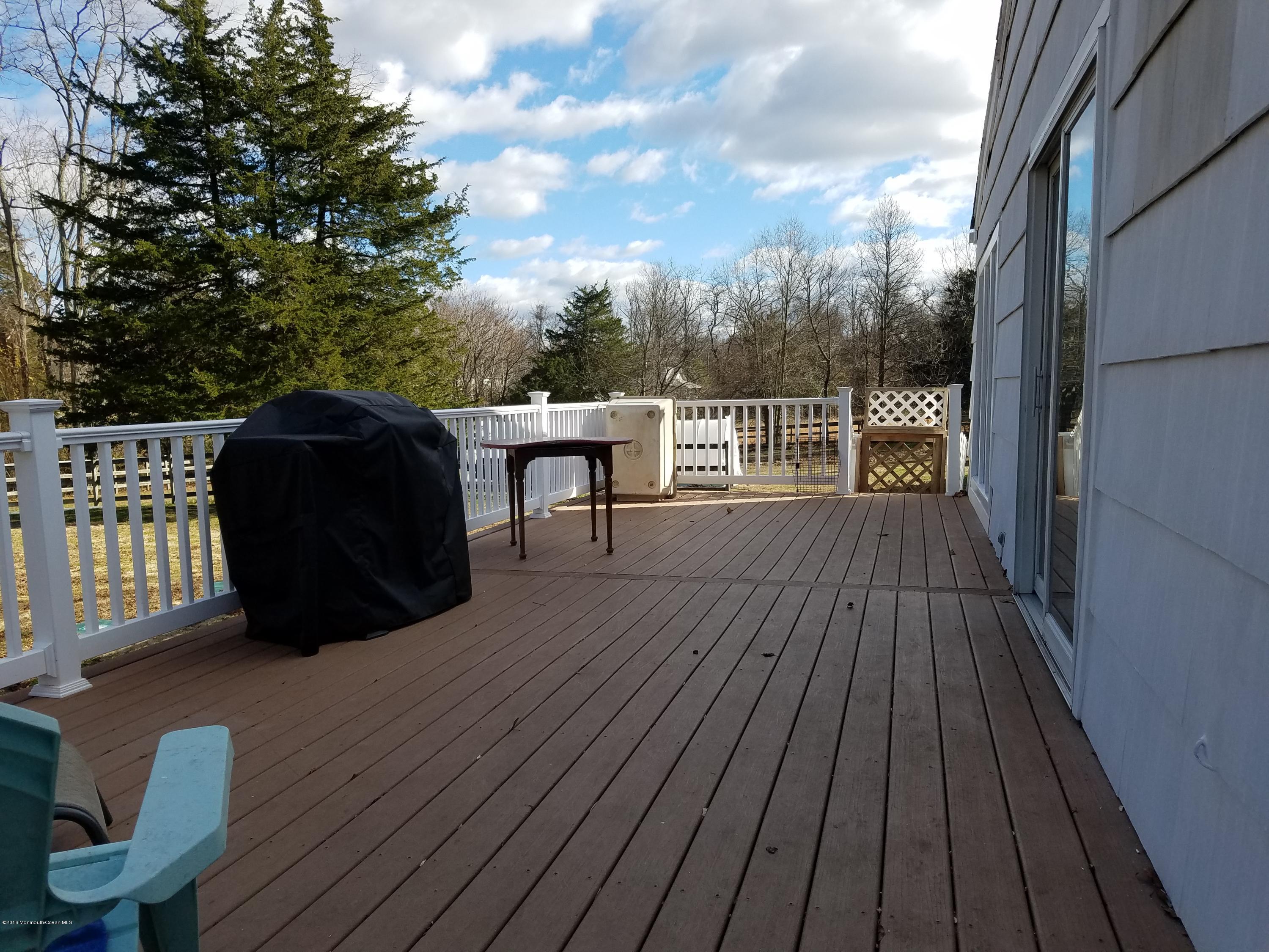 117 Maxim Road Howell, NJ 07731 - Photo 19 of 28 a view of a balcony with wooden floor
