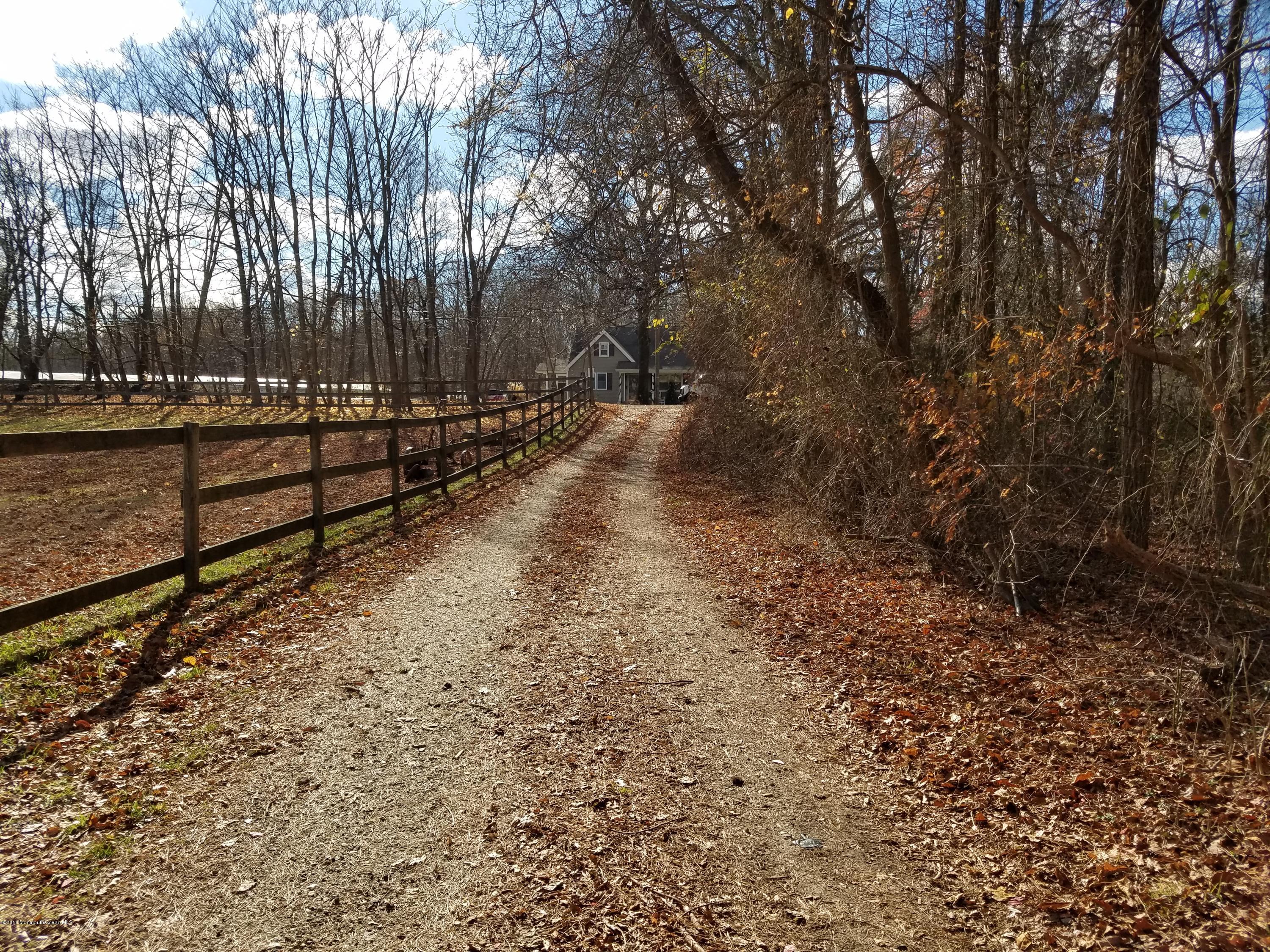 117 Maxim Road Howell, NJ 07731 - Photo 24 of 28 a view of a yard with wooden fence