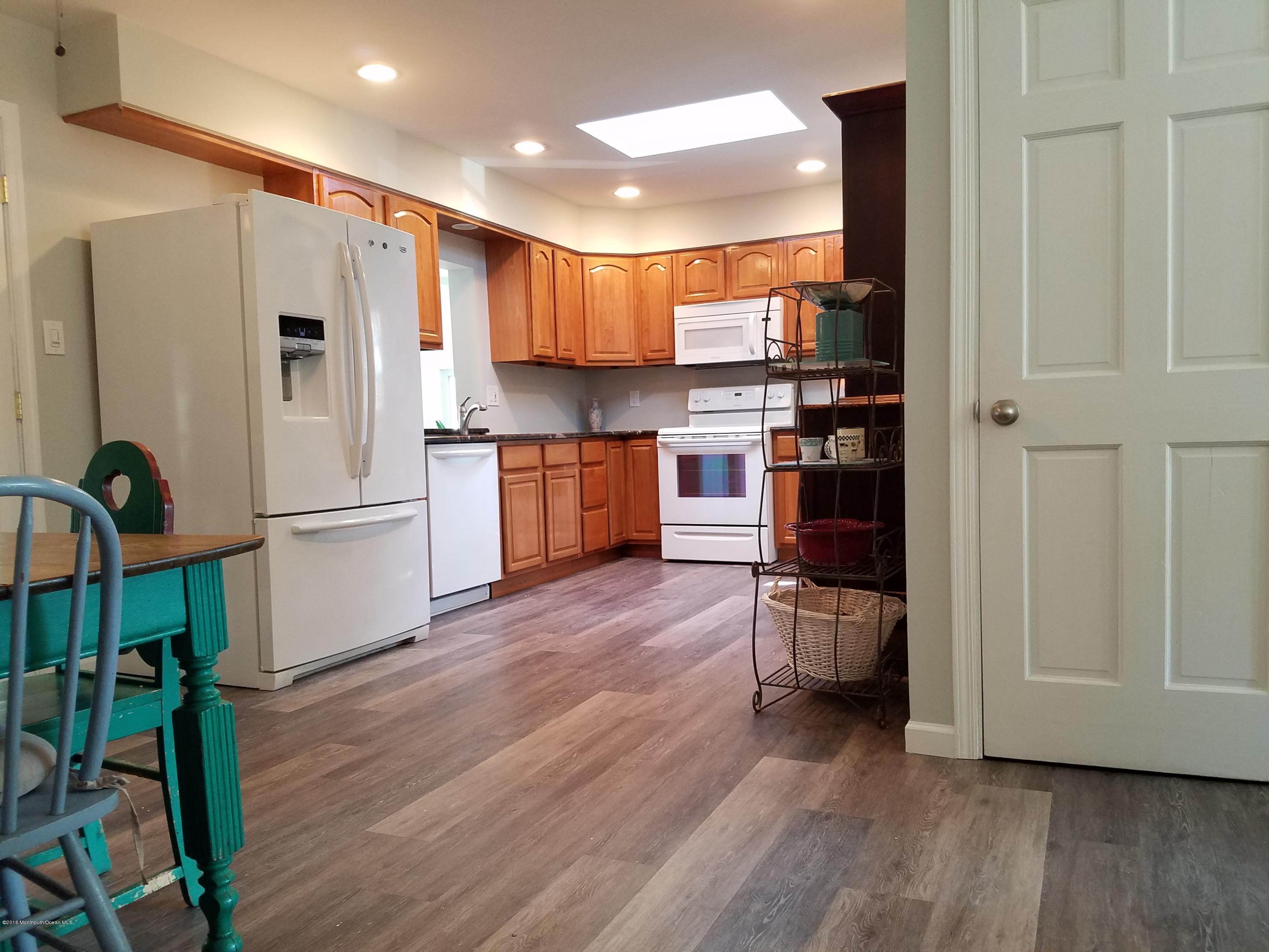 117 Maxim Road Howell, NJ 07731 - Photo 6 of 28 a kitchen with stainless steel appliances granite countertop a refrigerator and a stove top oven