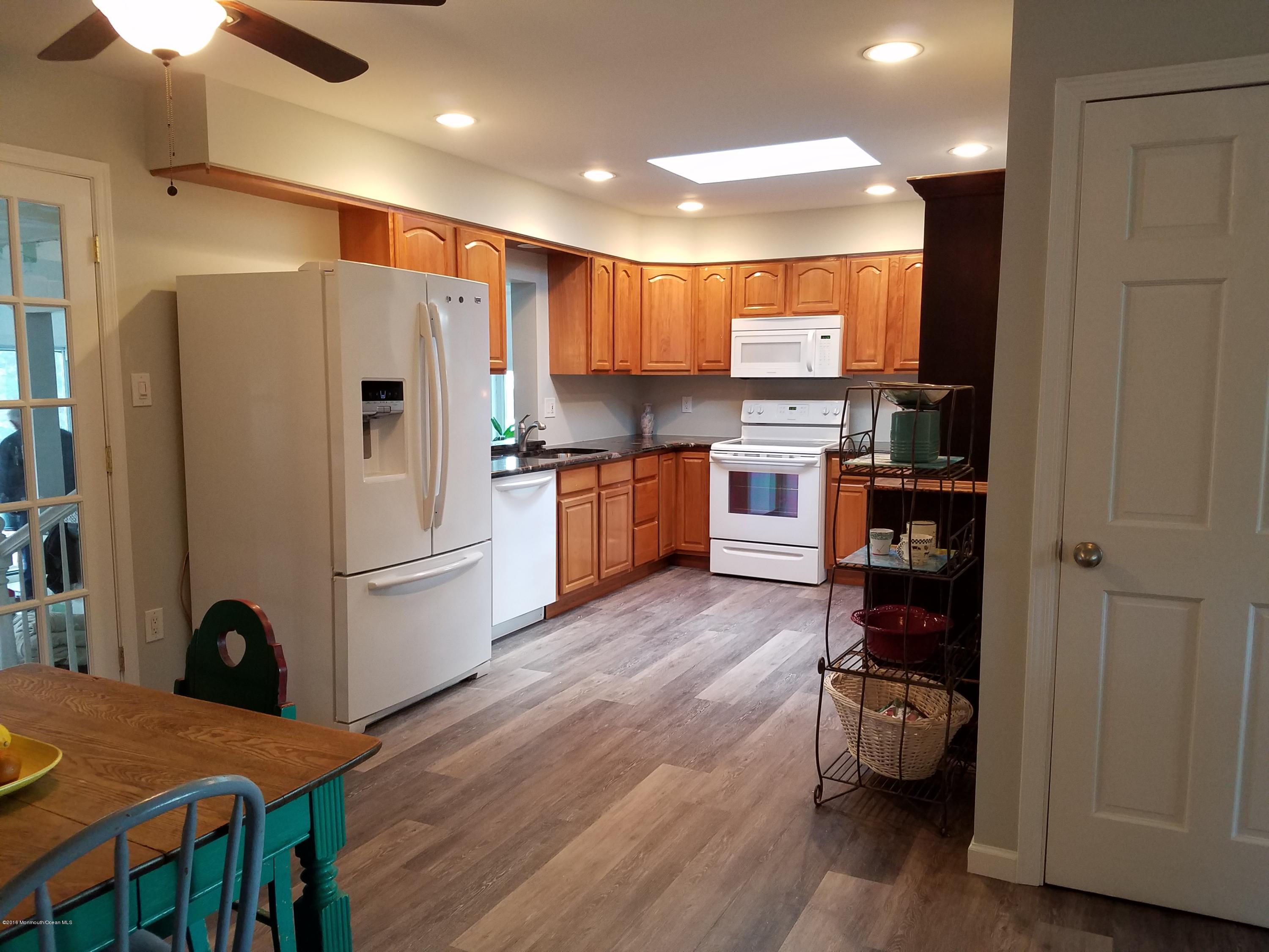117 Maxim Road Howell, NJ 07731 - Photo 7 of 28 a kitchen with stainless steel appliances granite countertop a refrigerator sink and stove