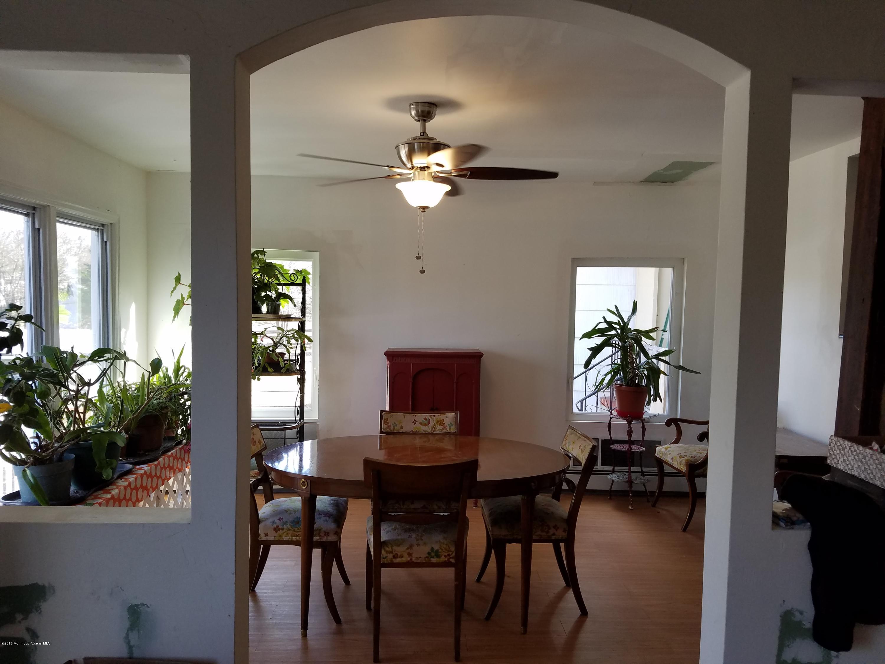 117 Maxim Road Howell, NJ 07731 - Photo 8 of 28 a view of a dining room with furniture and a potted plant