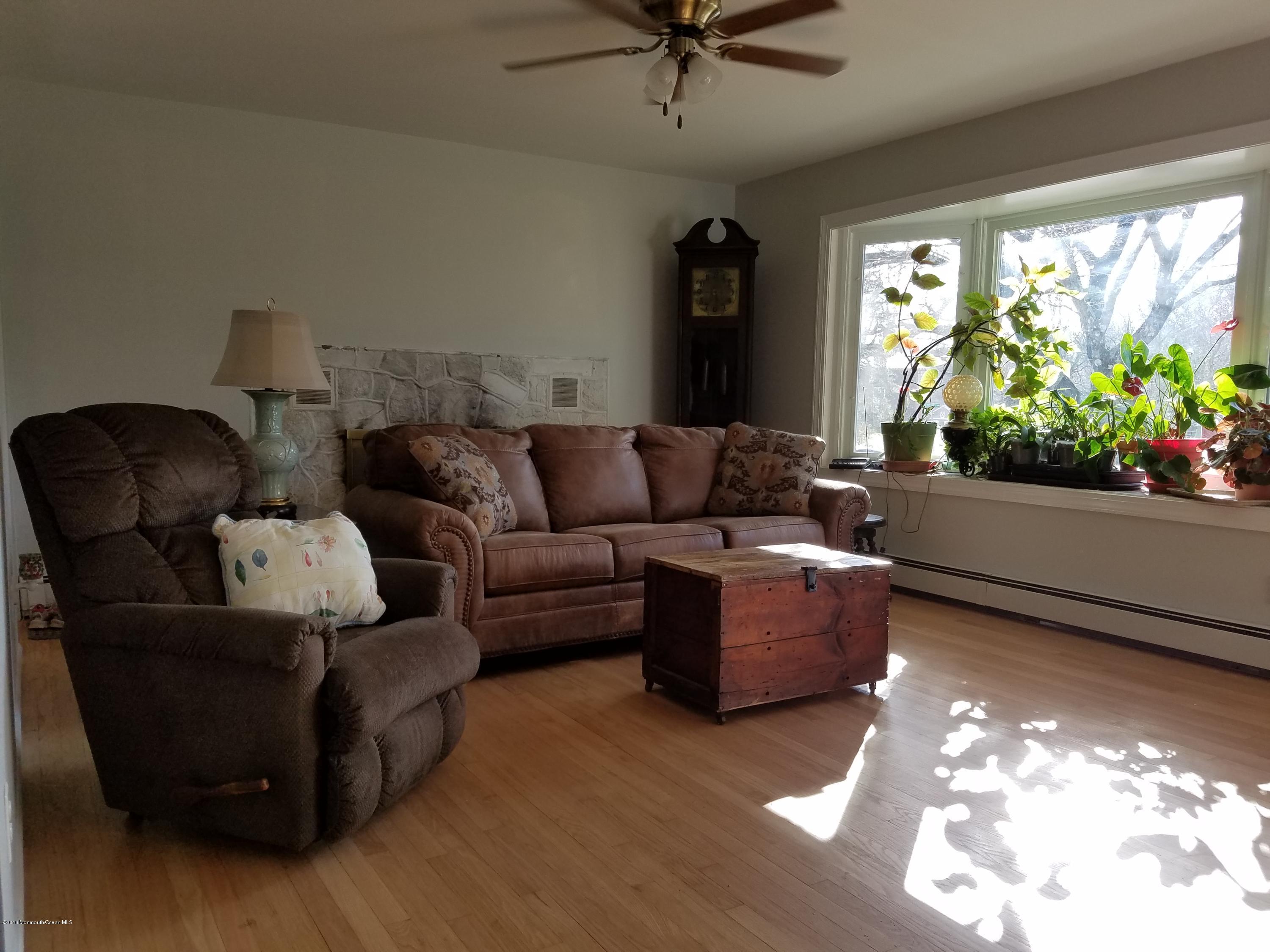 117 Maxim Road Howell, NJ 07731 - Photo 10 of 28 a living room with furniture and a large window
