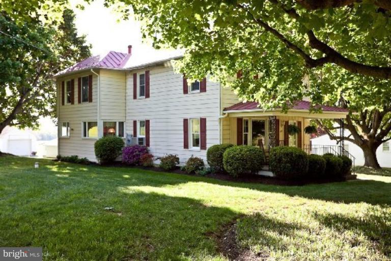 3754 Black Rock Road Upperco, MD 21155 - Photo 1 of 18 a front view of a house with a garden