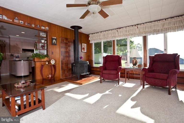 3754 Black Rock Road Upperco, MD 21155 - Photo 2 of 18 a living room with furniture a rug and a chandelier