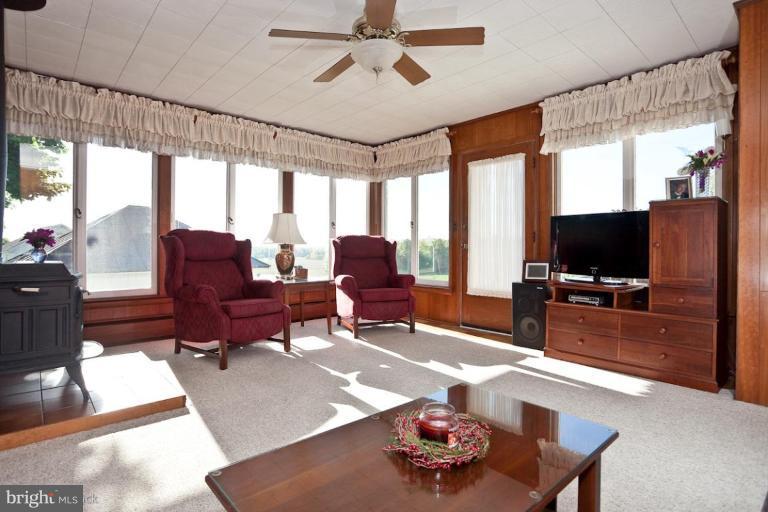 3754 Black Rock Road Upperco, MD 21155 - Photo 3 of 18 a living room with furniture and a flat screen tv