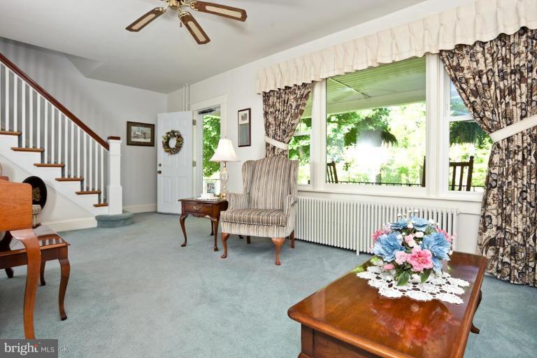 3754 Black Rock Road Upperco, MD 21155 - Photo 6 of 18 a living room with furniture and a chandelier